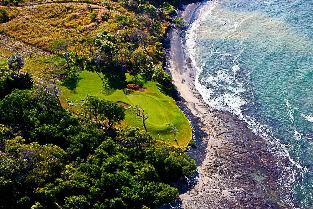 A fairway running down to the surf at Hacienda Pinilla