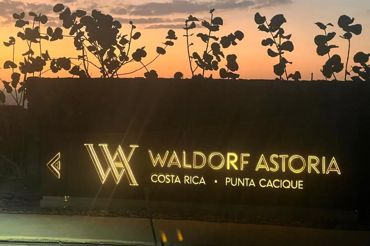 The illuminated Waldorf Astoria Costa Rica Punta Cacique sign at dusk